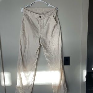 Xirena white pants with brown buttons and an adjustable waist.